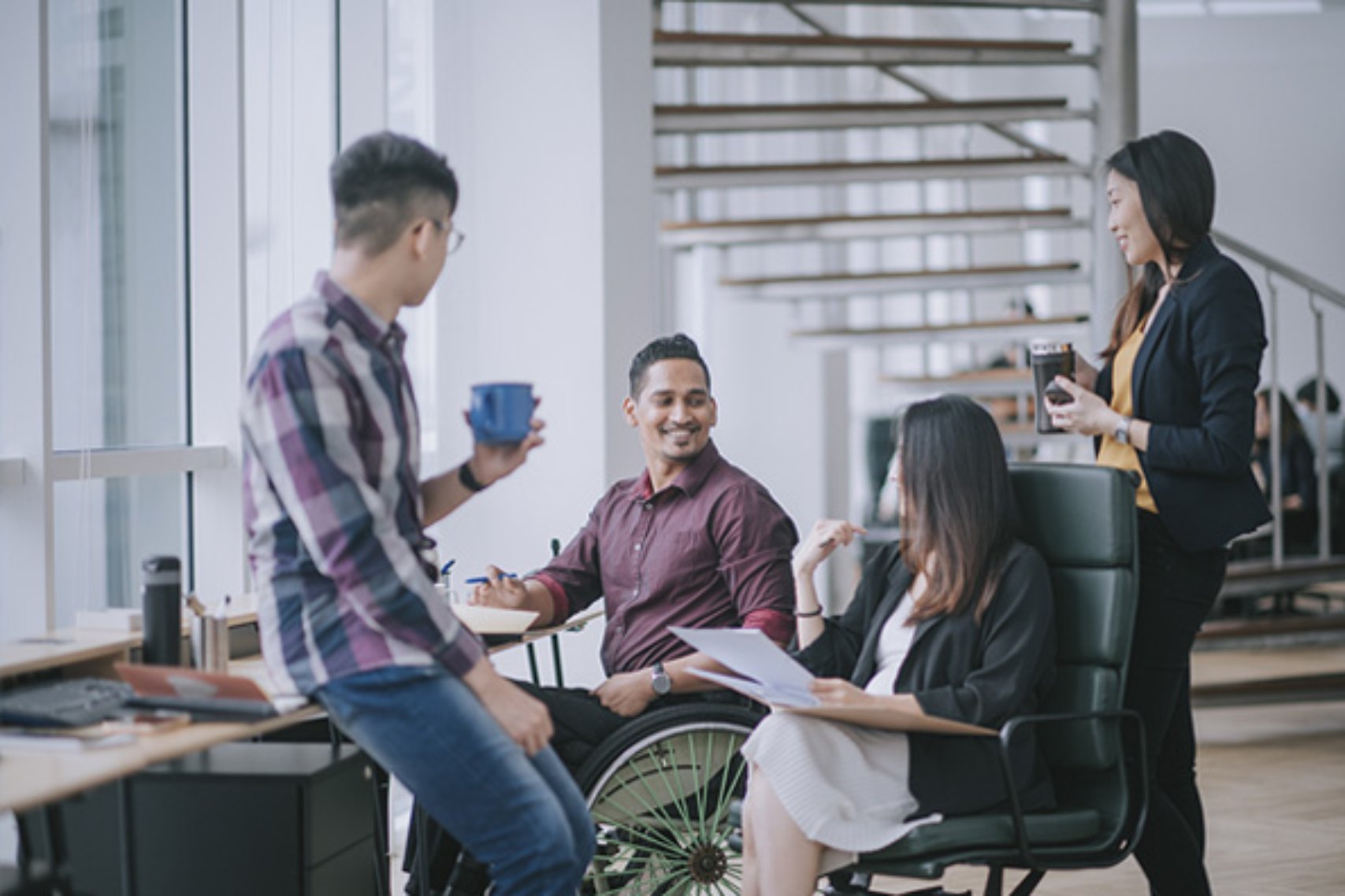 Employees discussing in office