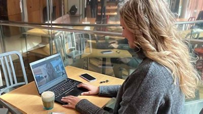 Woman on her laptop with a cup of coffee