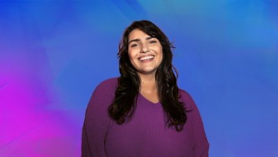 A woman wearing purple smiling