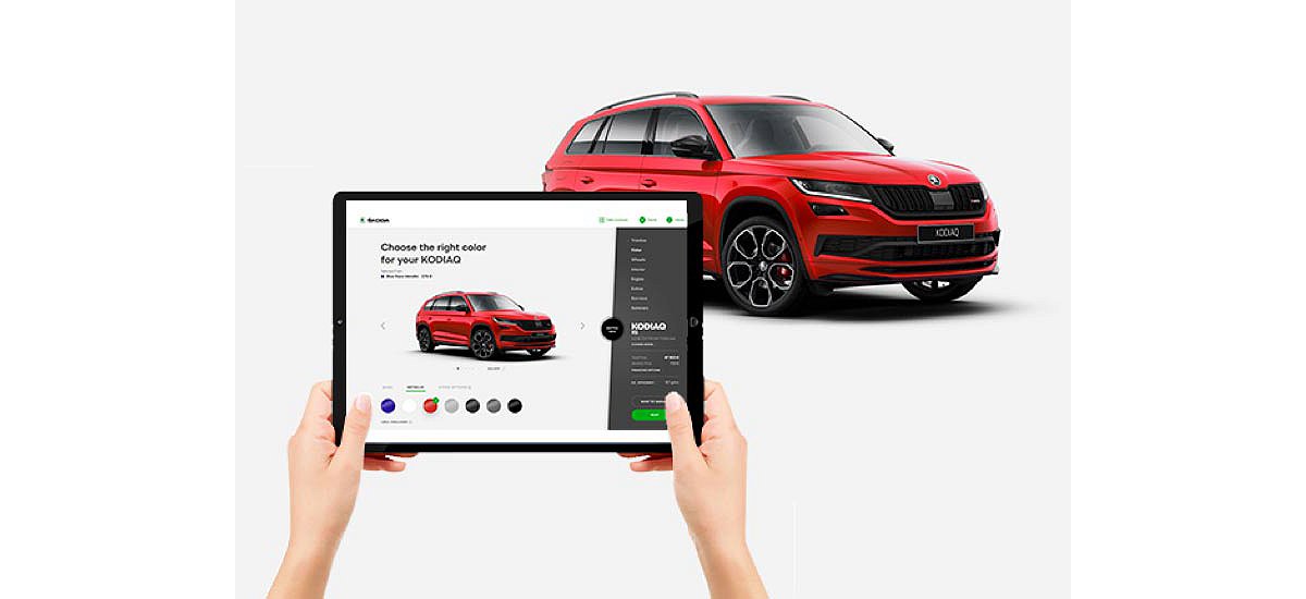 Image of the product: a person using a tablet to create their car preferences.