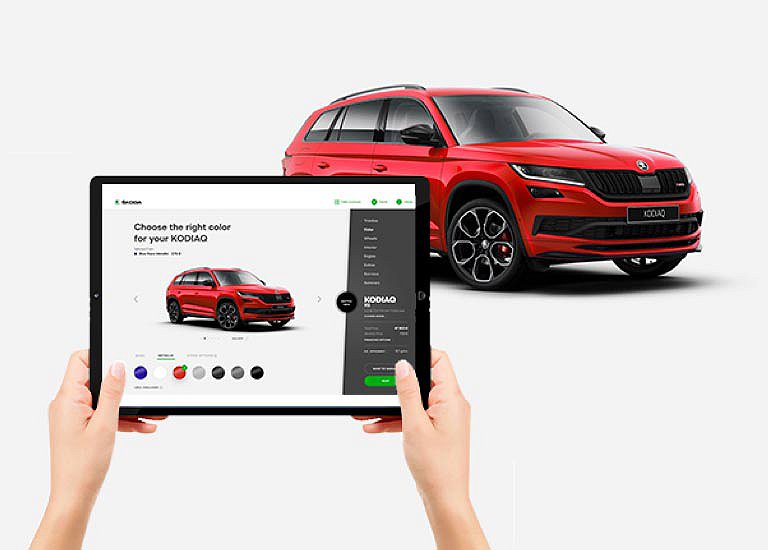 Image of the product: a person using a tablet to create their car preferences.