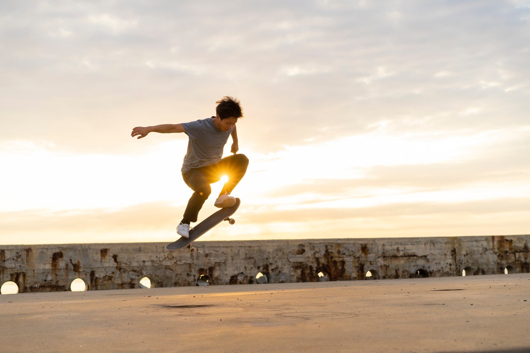 A man performing a jump on a skateboard