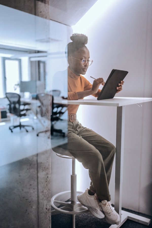 Woman sitting with tablet