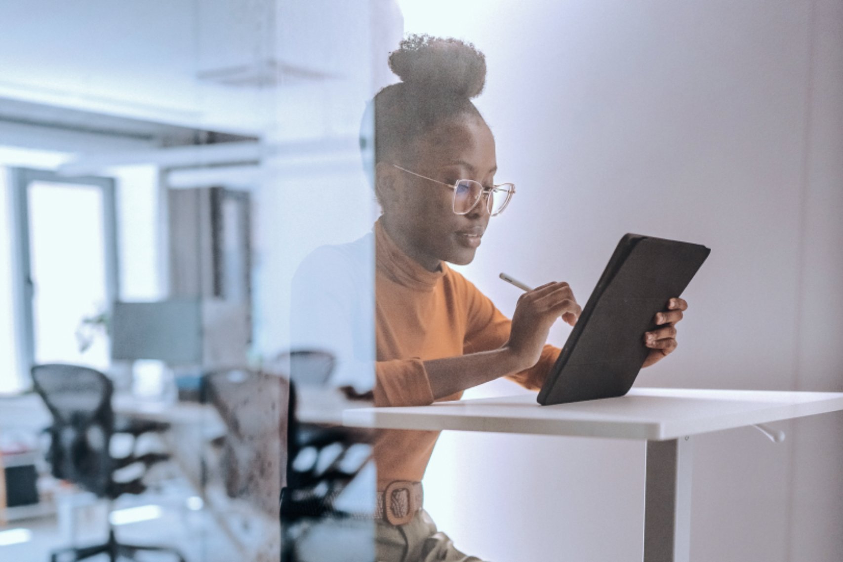 Woman sitting with tablet