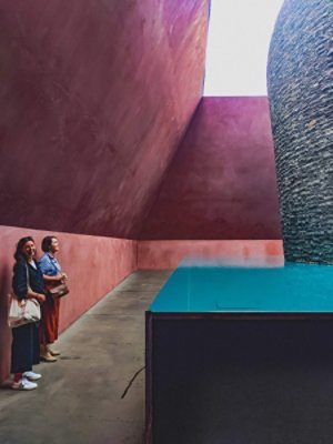 Two woman looking at a unique piece of architecture