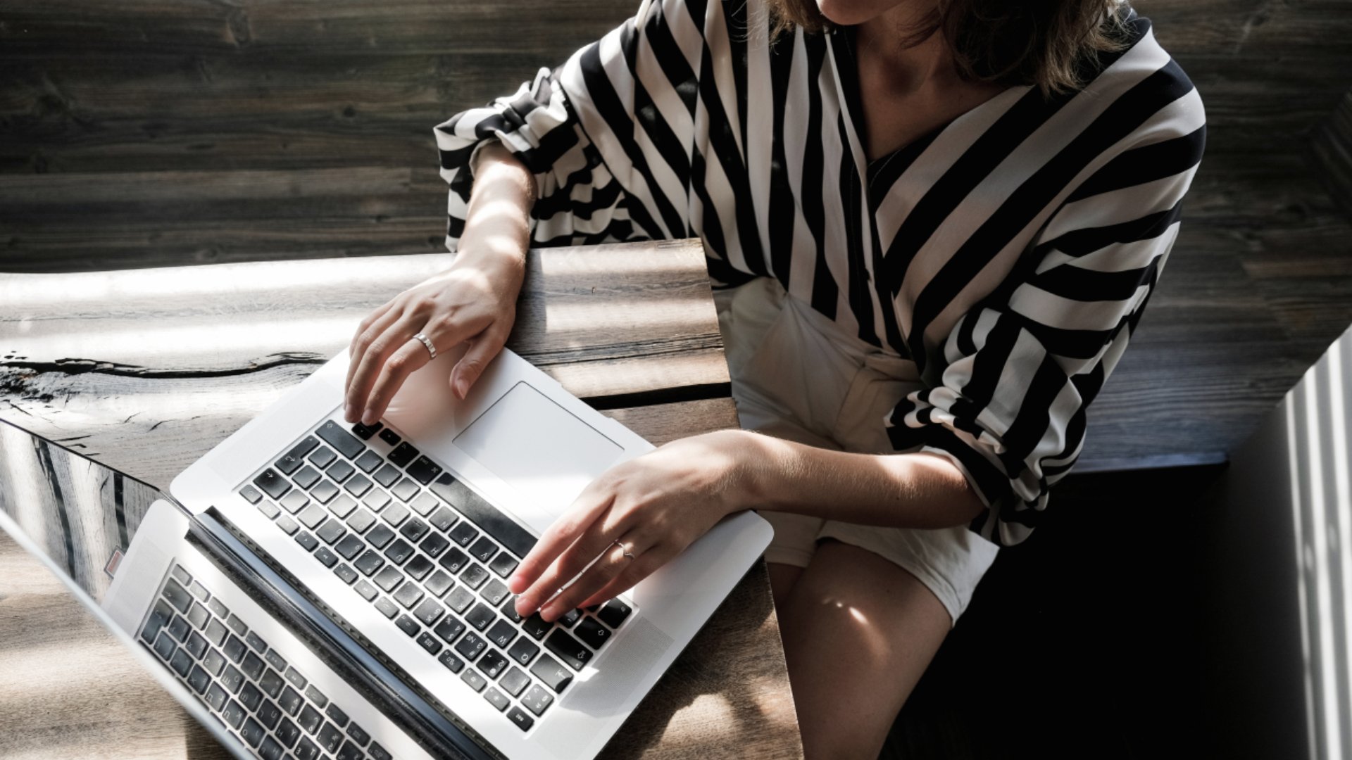 Woman typing on laptop