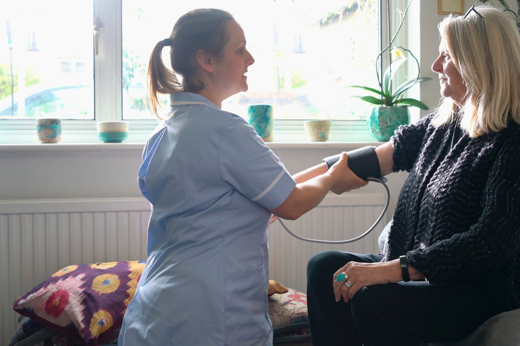 Two women checking blood pressure